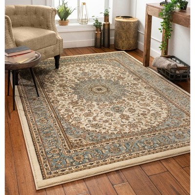 Ivory and Blue Medallion 5' x 7' Synthetic Area Rug