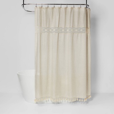 tan and white shower curtain