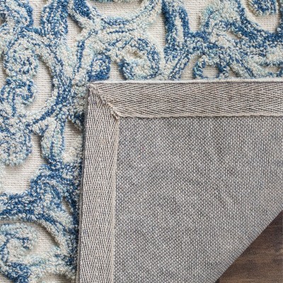 Handmade Blue and Ivory Wool 9' x 12' Tufted Area Rug