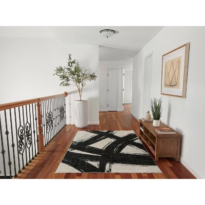 Ivory and Black Abstract Polyester Runner Rug