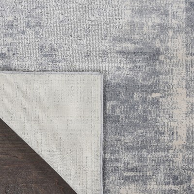 Modern Abstract Blue & Ivory Synthetic 9'3" x 12'9" Area Rug