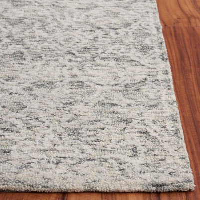 Ivory Tufted Handmade Wool 6' x 9' Area Rug
