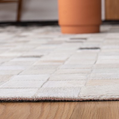 Handmade Black and Ivory Geometric Cowhide Area Rug