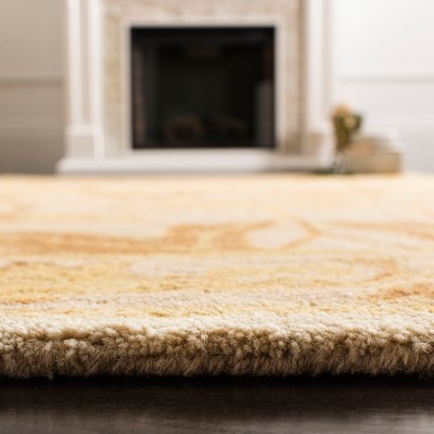 Elegant Ivory & Gold Hand-Tufted Wool Area Rug - 5' x 8'