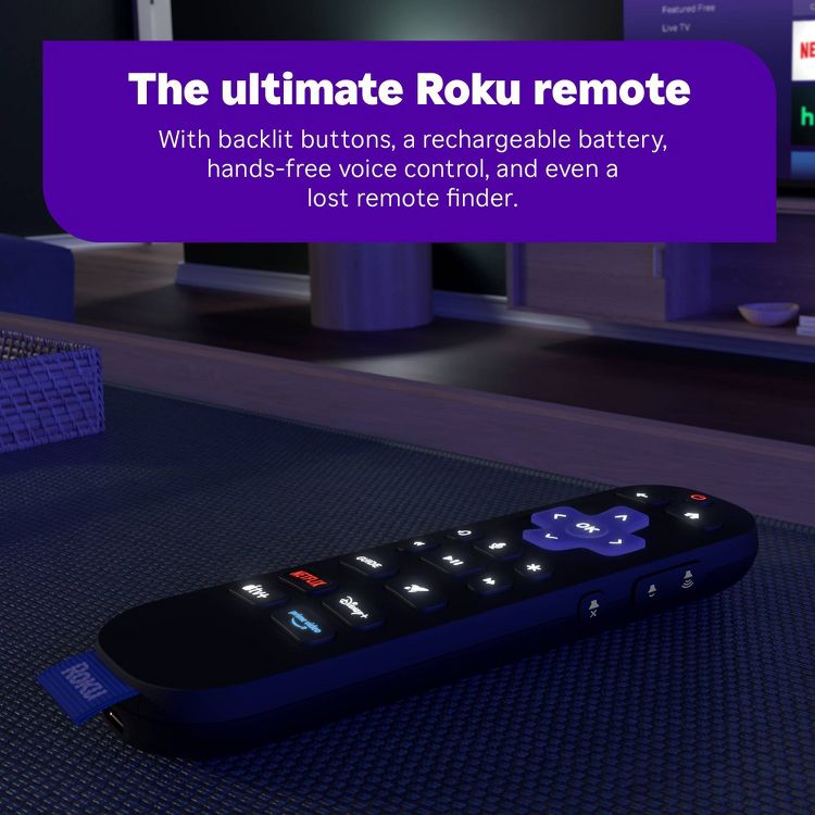 Roku Ultra – A black Roku remote with backlit buttons is placed on a dark surface, featuring a purple directional pad and labeled buttons for streaming services.