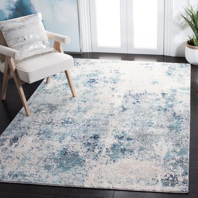 Ivory and Blue Abstract Synthetic Area Rug, 3' x 5'