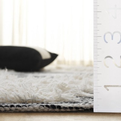 Kenya Tribal Artistry Black and Ivory Wool 8' x 10' Rug