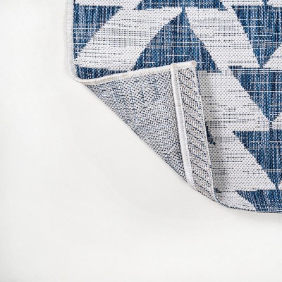 Ivory and Blue Geometric 4' x 6' Synthetic Area Rug