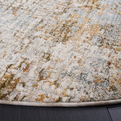 Adrianna Blue and Gold Round Synthetic Area Rug, 6'-7"