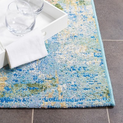 Reversible Light Blue Synthetic 4' x 6' Stain-Resistant Area Rug
