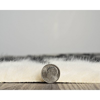 Black Spot Tufted Faux Cowhide 5'x6'6" Rug