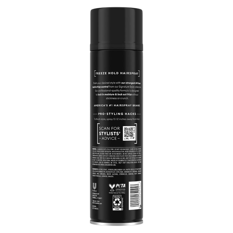 Black colored hairspray can with "Freeze Hold Hairspray" and styling instructions printed on the back.