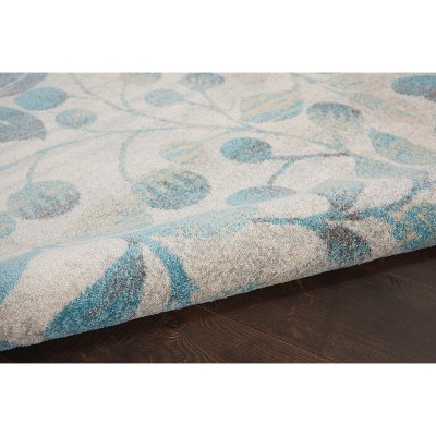 Ivory and Turquoise Floral Synthetic 6' x 9' Area Rug