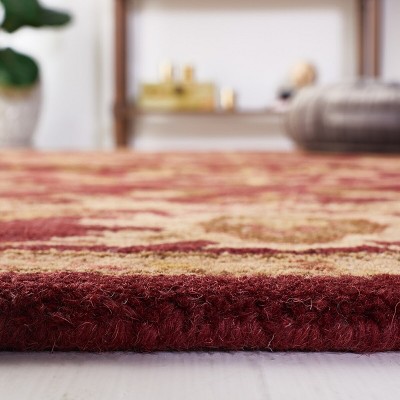 Handmade Wine and Gold Tufted Wool Area Rug