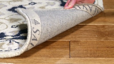 Handmade Ivory Wool Tufted Round Rug - 59 in Diameter