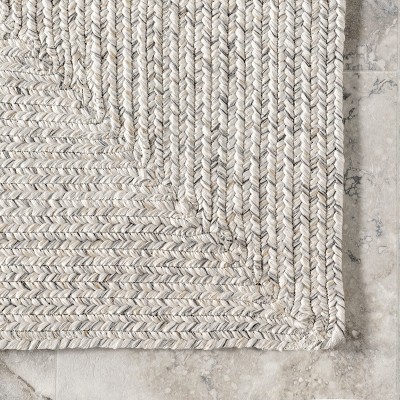 Handmade Ivory Braided 4' x 6' Oval Synthetic Area Rug