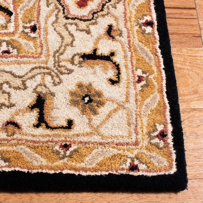 Hand-Tufted Black and Ivory Wool Oval Area Rug