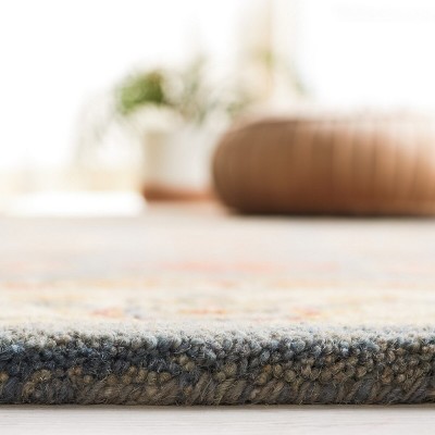 Handmade Light Blue and Ivory Floral Wool 6' x 9' Area Rug