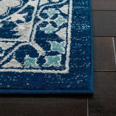Evoke Blue and Ivory Synthetic 11' x 15' Area Rug