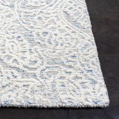 Light Blue and Ivory Floral Wool 8' x 10' Handmade Tufted Rug