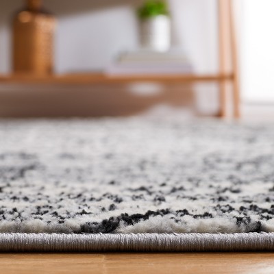 Brentwood Black and Ivory 8' x 10' Synthetic Area Rug