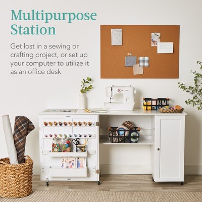 Compact White Folding Sewing and Craft Table with Storage and Caster Wheels