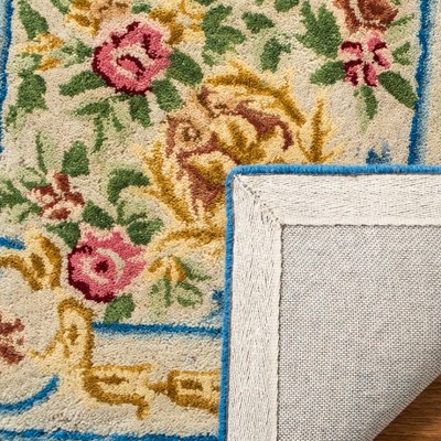 Handmade Blue and Ivory Wool 4' x 6' Tufted Area Rug