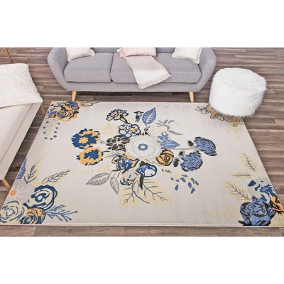 9' x 12' Blue and Ivory Floral Synthetic Area Rug