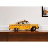 HomeRoots 13" Yellow Metal Hand Painted NYC Taxi Tabletop Sculpture - 2 of 4