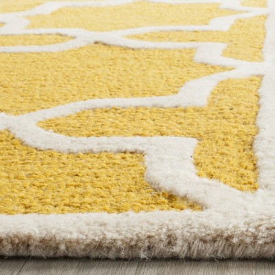 Hand-Tufted Gold and Ivory Wool Rectangular Accent Rug, 3'x5'