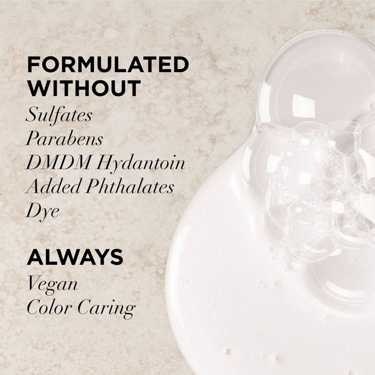 Text on a beige background reads "FORMULATED WITHOUT Sulfates, Parabens, DMDM Hydantoin, Added Phthalates, Dye" and "ALWAYS Vegan, Color Caring" next to a white liquid with bubbles.