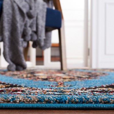 Vintage Blue and Black Synthetic Rectangular Area Rug 6'7" x 9'