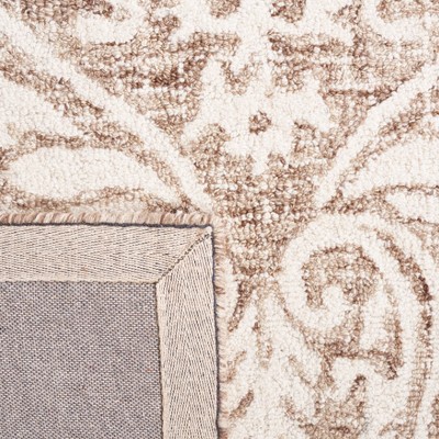 Ivory and Beige Abstract Wool 6' x 9' Handmade Tufted Rug