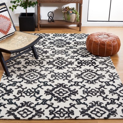 Handmade Black and Ivory Wool Floral 8' x 10' Rug