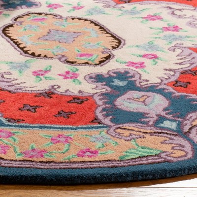 Handmade Round Ivory and Pink Wool Viscose Area Rug