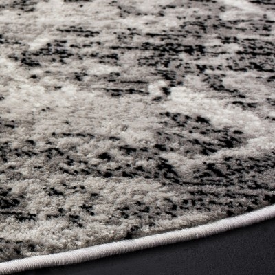 Charcoal and Ivory Round Medallion Synthetic Area Rug