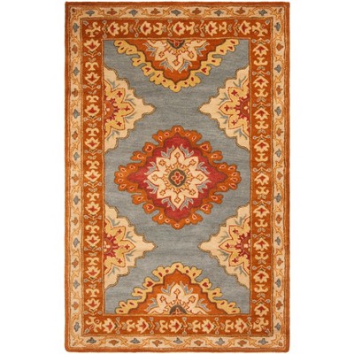 Hand-Tufted Blue and Rust Wool 5' x 8' Area Rug