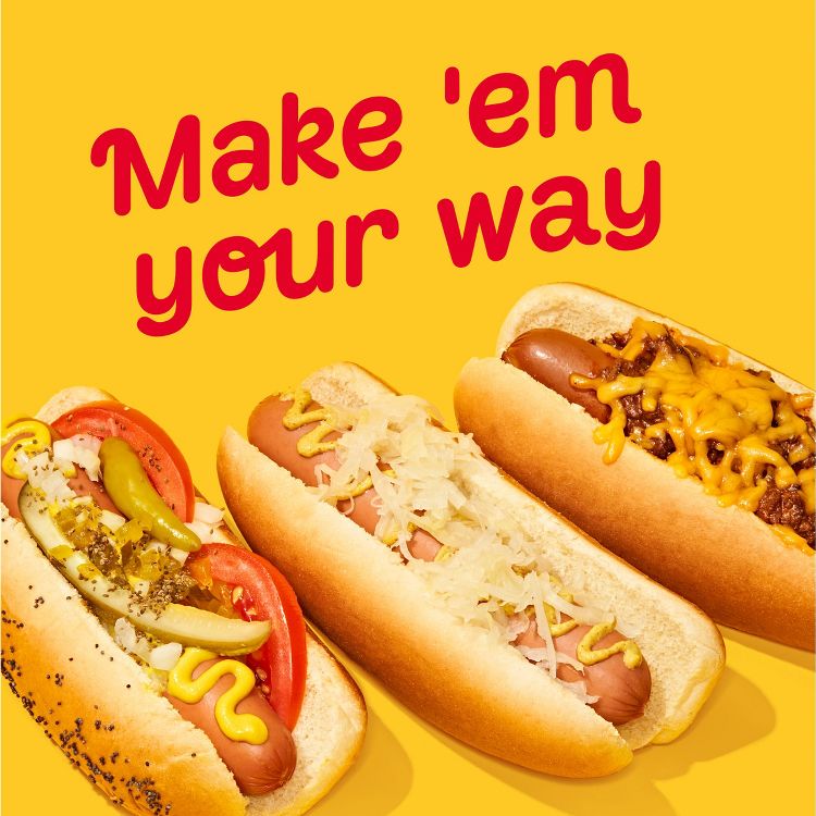 Three hot dogs with different toppings including mustard, pickles, tomatoes, sauerkraut, and cheese, with the text "Make 'em your way" above.