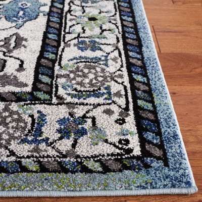 Blue and Ivory Synthetic Persian Area Rug, 5'3" x 7'6"
