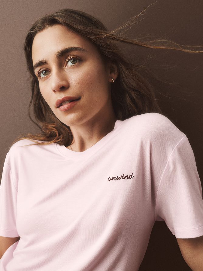 This light-pink loungewear top is ridiculously soft and features a small inspirational saying "unwind." The goal of this design is a refreshing night's sleep.