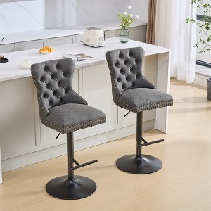 Set of two modern upholstered bar height swivel stools with tufted backs and studded accents, height adjustable - 1 of 4