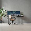 Shaped Electric Standing Desk, 63 x 47.2 inches. A height - adjustable corner desk with power outlets and 2 memory buttons. - 4 of 4
