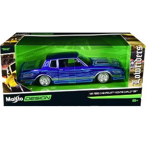 1986 Chevrolet Monte Carlo SS Lowrider Candy Blue with Graphics "Lowriders" Series 1/24 Diecast Model Car by Maisto - 1 of 3