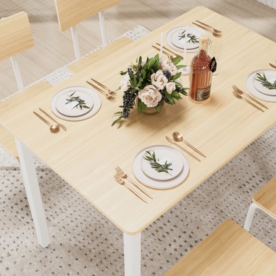 Top-down view of table setting showing dining set with centerpiece