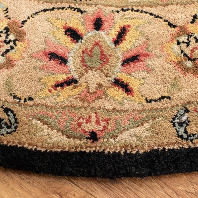 Handmade Black Wool and Cotton Round Tufted Rug, 6' x 6'