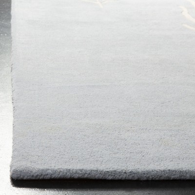 Handmade Light Blue and Ivory Wool Area Rug
