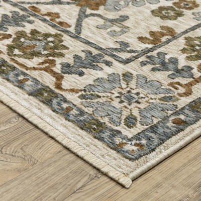 Hastings Ivory and Green Synthetic Rectangular Area Rug 5'3" x 7'6"