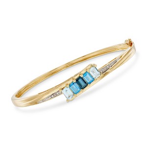 Ross-Simons 3.10 ct. t.w. Tonal Blue Topaz Bangle Bracelet With Diamond Accents in 18kt Gold Over Sterling - 1 of 3