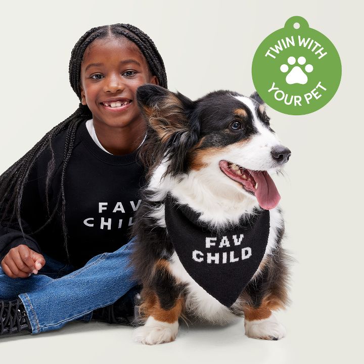 girl with a corgie wearing matching "fav child" clothing from the collection.