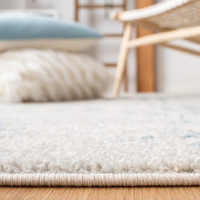 Ivory & Turquoise Geometric 9' x 12' Reversible Synthetic Rug